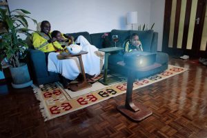 friends watching a movie using the MoKo c-table to place a projector